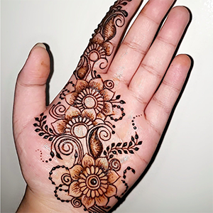 neat henna design on the palm